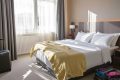 Pourquoi la couverture au pied du lit d’hôtel est indispensable